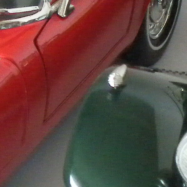 Samsung WB5000 camera photo of red and green vintage cars.