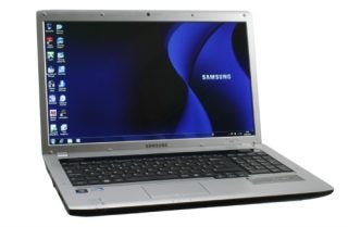 Samsung R730 laptop open with desktop display visible.