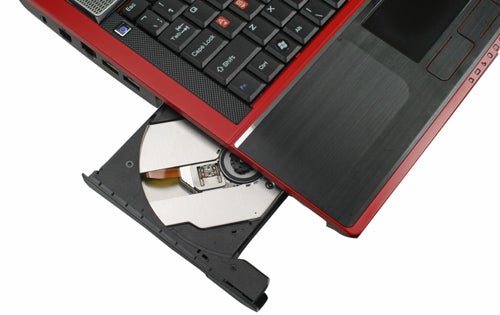 MSI GT740 gaming laptop with open optical disk drive.