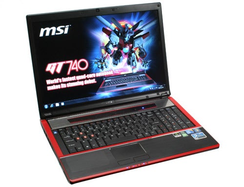 MSI GT740 gaming laptop with open lid and screen displaying graphics.