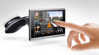Finger touching Navigon 8450 Live GPS device screen.