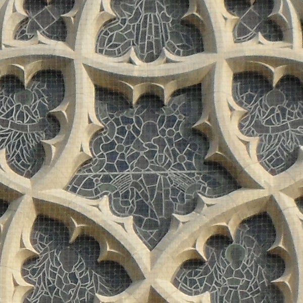 Intricate stone lattice work on a building facade
