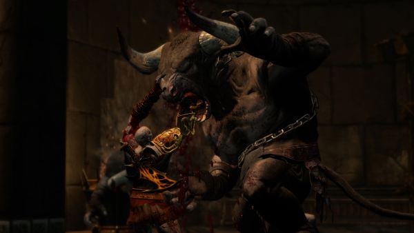 God of War III gameplay showing battle with a Minotaur.