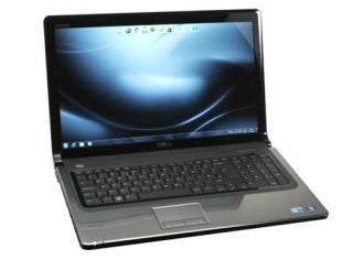 Dell Inspiron 1764 laptop with open lid displaying screen.