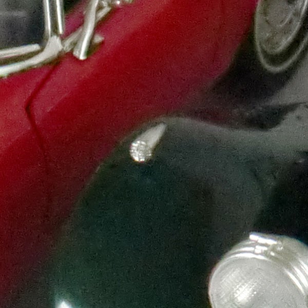 close-up of a red object with a shiny detail.