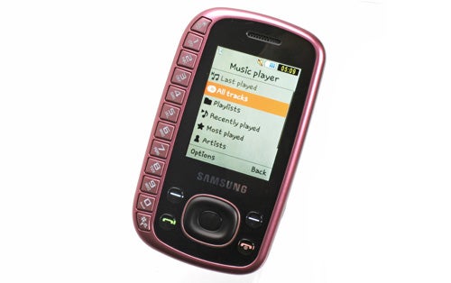 Samsung GT-B3310 phone with music player screen on display.