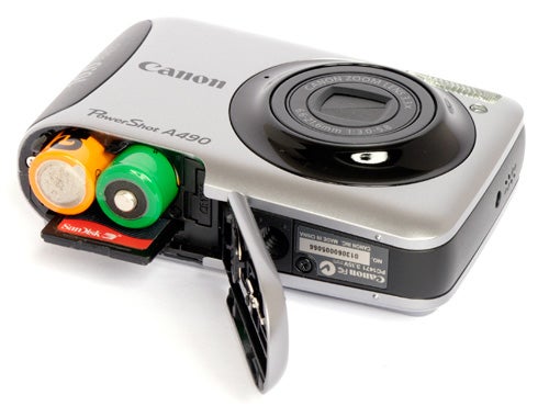 Canon PowerShot A490 camera with open battery compartment.