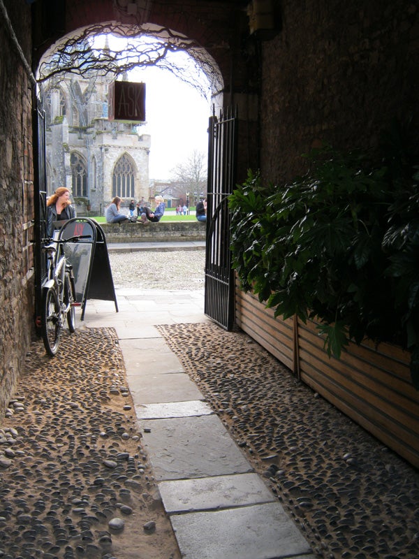 Photo taken with Canon PowerShot A490 showing arched alleyway view.