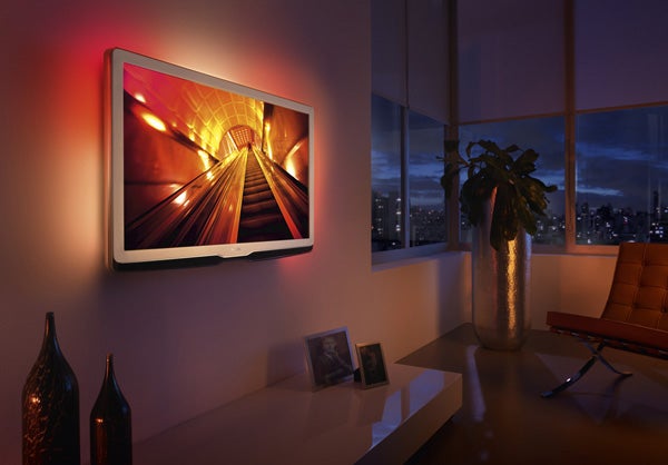 Philips LED TV on wall displaying vibrant tunnel image.