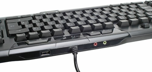 Logitech G110 gaming keyboard with multimedia keys and USB port.