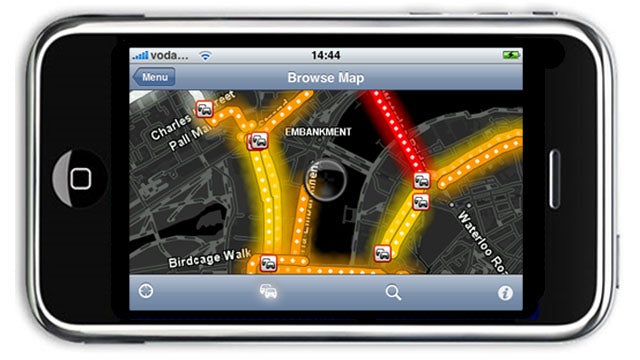 iPhone with TomTom GPS navigation app displaying map and traffic.