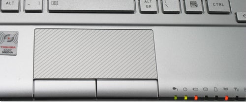 Close-up of Toshiba NB305-106 netbook keyboard and trackpad.