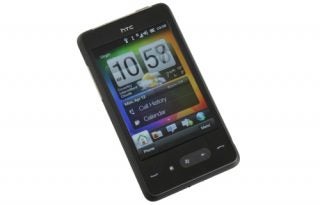 HTC HD mini smartphone displaying time and menu.