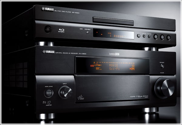 Yamaha DB-S1900 Blu-ray Player stacked with audio equipment.