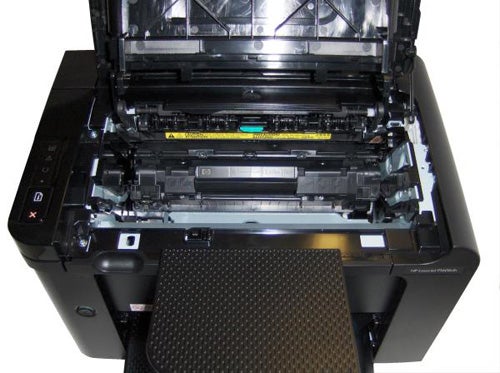 HP LaserJet Pro P1606dn printer with open cartridge access door.