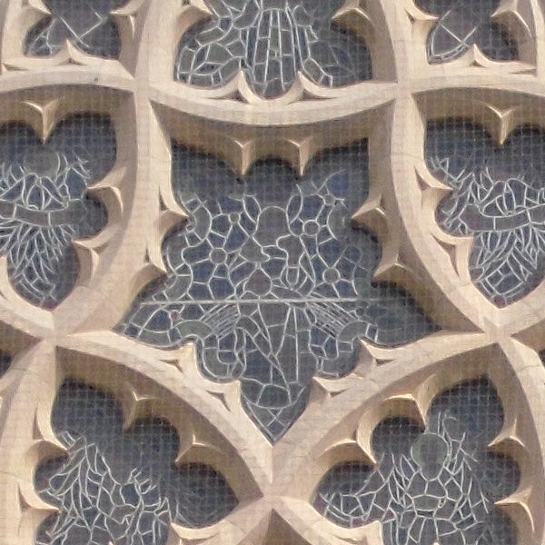 Close-up of gothic stone window tracery patterns.