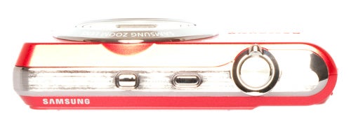 Side view of Samsung PL80 digital camera in red.