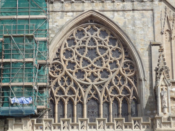 Detailed photo of Gothic church window architecture.