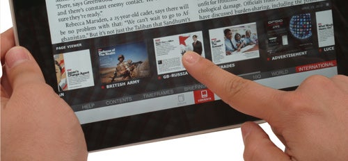 Hands interacting with Apple iPad displaying news article.