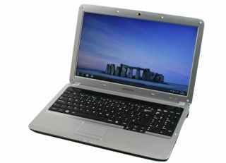 Samsung R530-JA03UK laptop with screen displaying wallpaper.