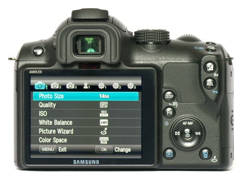 Samsung NX10 camera with settings displayed on screen.