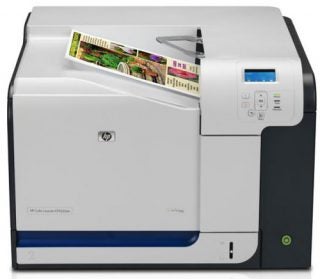 HP Color LaserJet CP3525dn printer with printed pages.