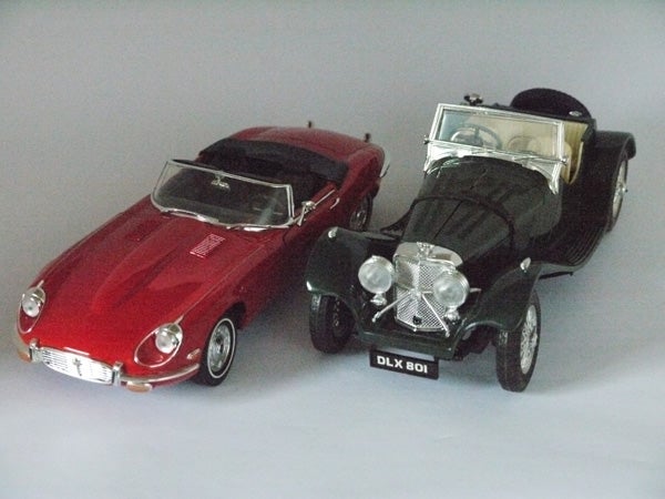 Toy model cars photographed with soft lighting.