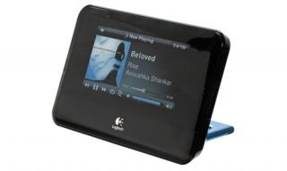 Logitech Squeezebox Touch music player displaying album art.