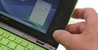 Close-up of Sony VAIO P Series mini laptop with green keyboard.