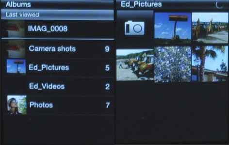 HTC Smart phone displaying photo album interface.