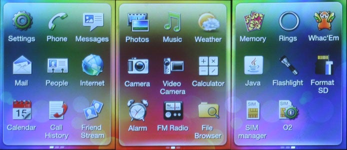 HTC Smart phone displaying colorful application icons on screen.