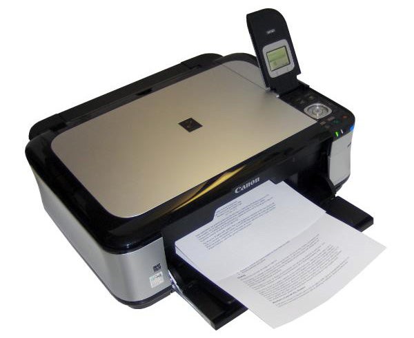 Canon PIXMA MP560 printer with printed document.