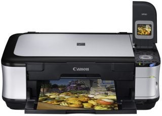 Canon PIXMA MP560 printer with color printout.