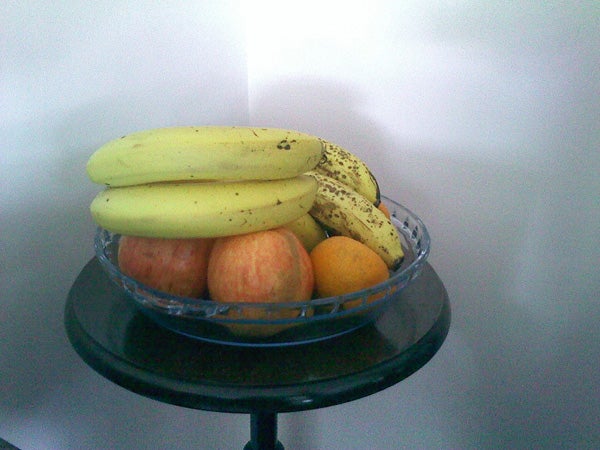 Bowl of fruit on a table captured by ZTE F102 camera.