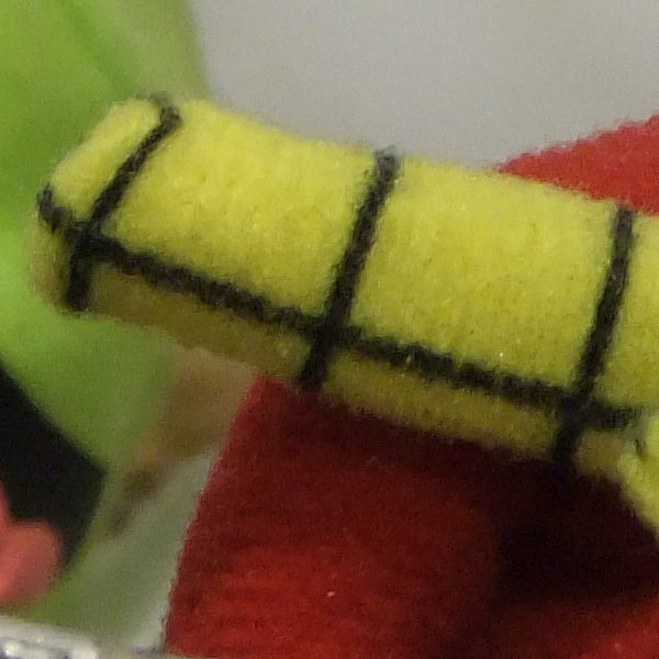 Close-up photo of a yellow and black textured object.
