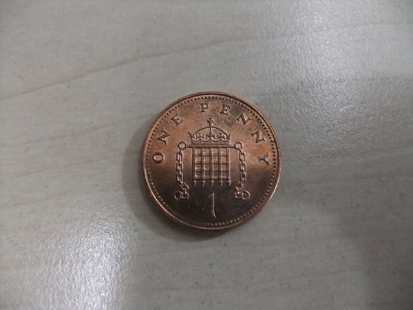Close-up photo of a one penny coin.