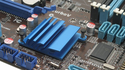 Close-up of Asus P7H55D-M EVO motherboard showing heatsinks and capacitors.