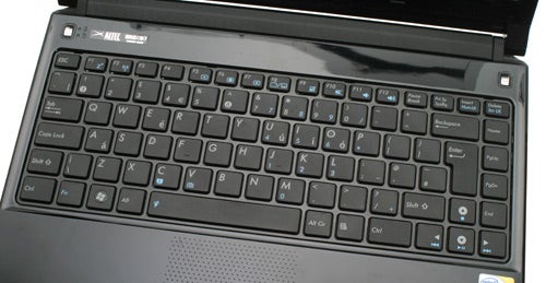 Close-up of Asus UL30A laptop keyboard and partial screen.