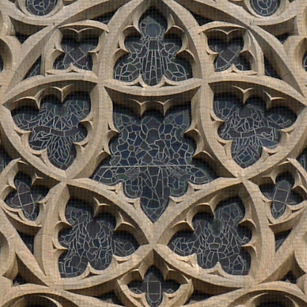 Intricate stone window design with geometric patterns