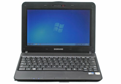 Samsung NB30 netbook with Windows screen displayed.
