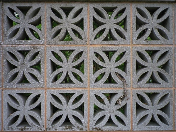 Decorative concrete breeze blocks forming a geometric pattern.
