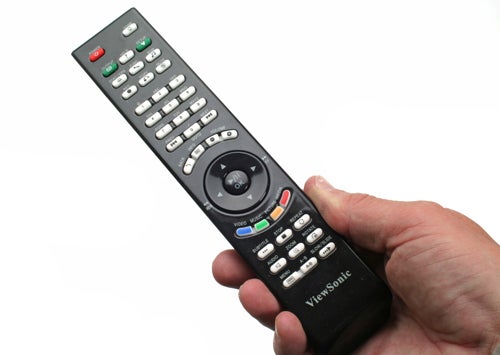 Hand holding a ViewSonic VMP74 remote control.