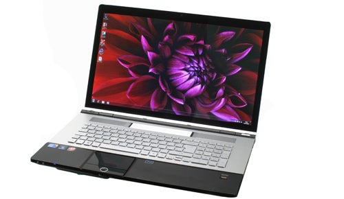 Acer Aspire Ethos 8943G laptop with flower wallpaper display.