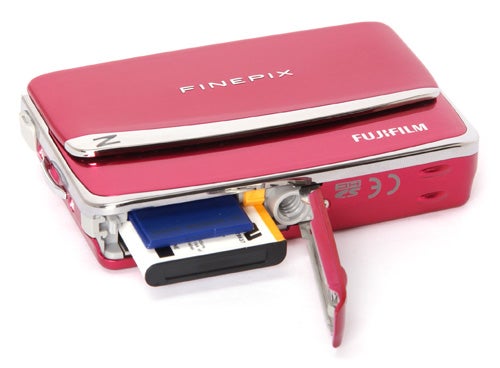 Fujifilm FinePix Z70 compact camera in pink with battery and memory card.