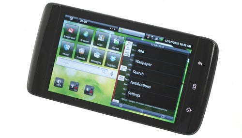 Dell Streak smartphone on display with screen icons visible.