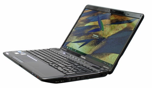 Toshiba Satellite A660-14C laptop open on a white surface.