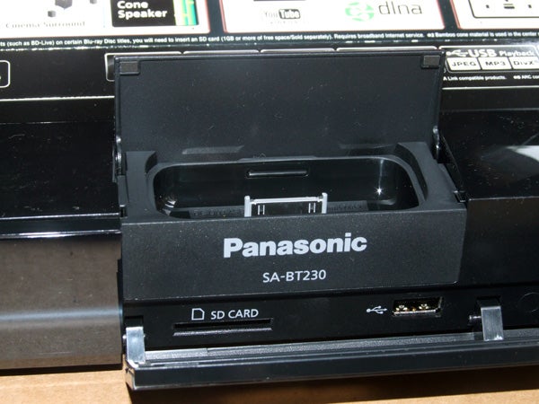 Panasonic SC-BT230 Blu-ray player with SD card slot open.