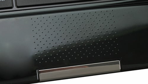 Close-up of MSI Wind U160 laptop's speaker grille and hinge.