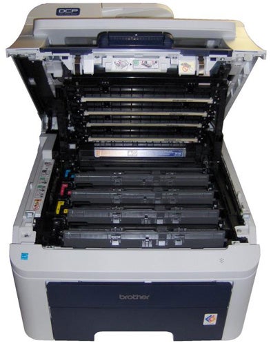 Brother DCP-9010CN printer with open cover showing toner cartridges.