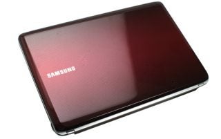 Samsung R530 laptop with red gradient cover design.